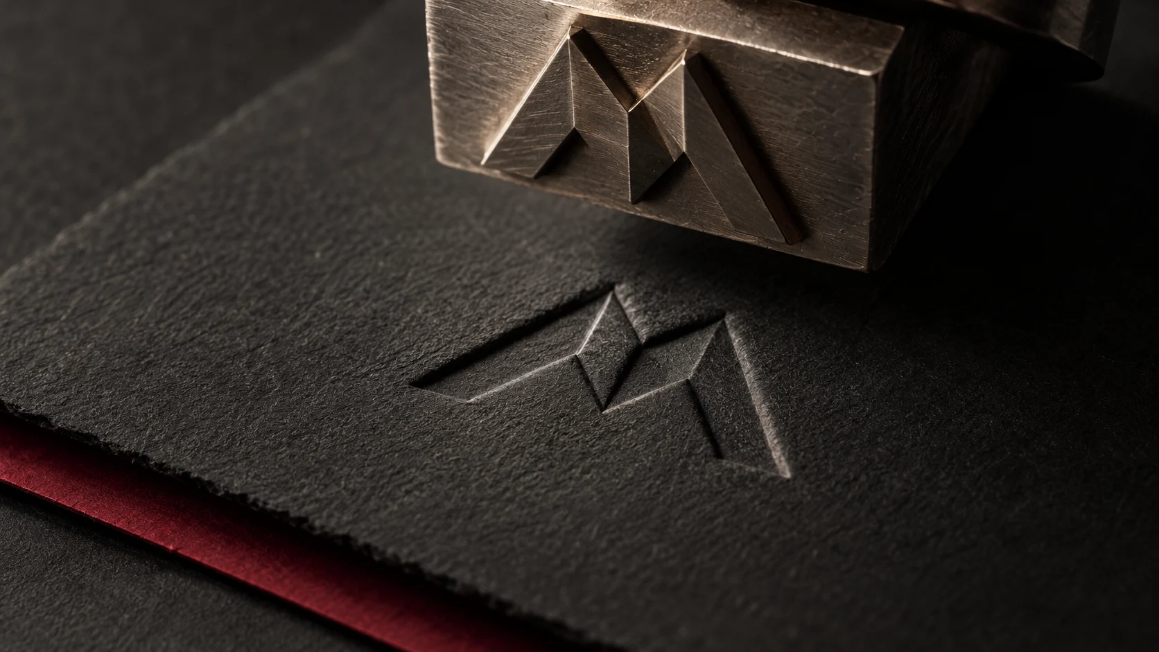 Precision embossing die and textured charcoal paper — concept artwork